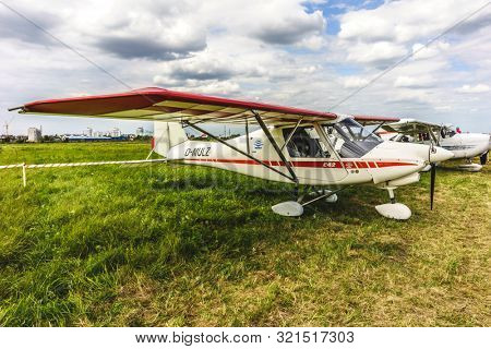 KALININGRAD, Russia - August 18, 2019: 100 Anniversary First European Airport Devau Fest, Ultra Light Propeller Screw Plane Ready for Flight