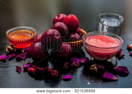 Plum Pulp Well Mixed With Water & Honey In A Glass Bowl Along With Raw Plums Or Prunes Or Aloo Bukha