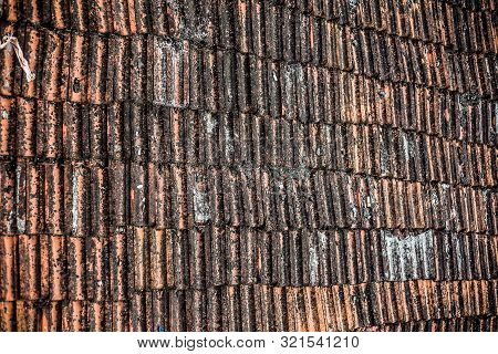 Top Shot Of The Old-styled Rectangular-shaped Rooftop Tiles Fixed On A Roof Of The House.
