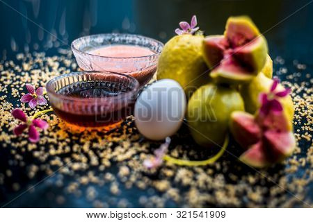 Treatment Of Dry Skin With The Help Of Face Mask On A Wooden Surface Consisting Of Honey, Guava Pulp