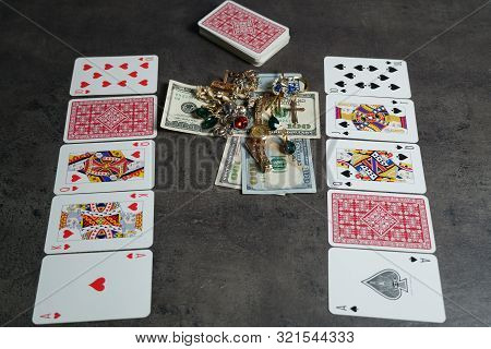 9 09 2019 Tallinn, Estonia: The Combination Of Flash Royal Cards On A Gray Table With Money And Gold