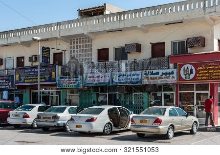 Salalah, Oman - November 12, 2017: Street View Of Salalah City At Day With Parked Cars Near Tourist 