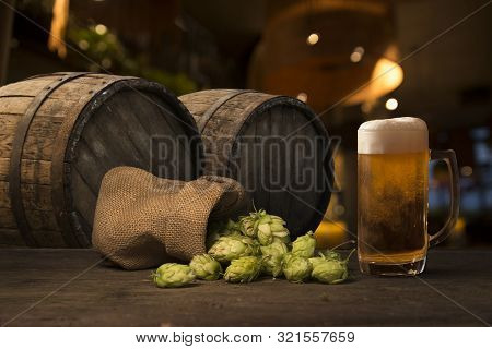 Beer Brewing Ingredients Hop In Bag And Wheat Ears On Wooden Cracked Old Table. Beer Brewery Concept