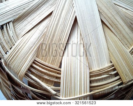 Basket Woven From A Vine In Warm Beige Tones