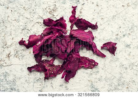 Healthy Homemade Vegetable Chips From Beetroot With Salt, Pepper And Origano On Black Background. Or
