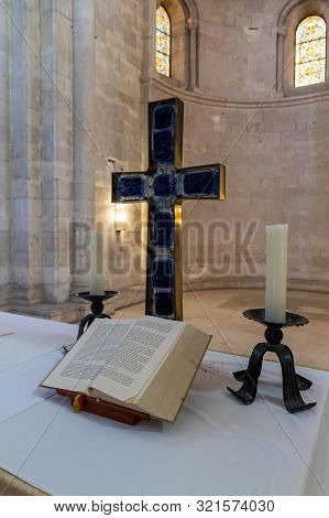 Jerusalem, Israel, September 07, 2019 : Cross, Candles And Scripture On The Table In The Lutheran Ch