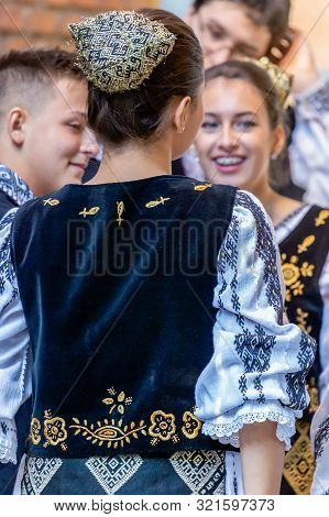 Romania, Timisoara - September 24, 2016: Romanian Dancers In Traditional Costume Perform Folk Dance 