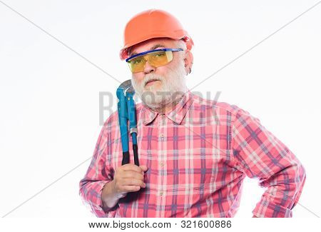 Plumber Service. Man Bearded Plumber Wear Helmet And Hold Wrench Tool. Repair Concept. Sanitary Engi