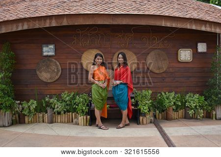 Kanchanaburi, Thailand, 09.09.2019: Beautiful Thai Girls In Traditional Thai, Siamese Dress With Gre