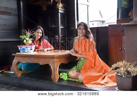 Kanchanaburi, Thailand, 09.09.2019: Beautiful Thai Girls In Traditional Thai, Siamese Dress With Gre