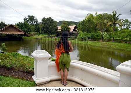 Kanchanaburi, Thailand, 09.09.2019: Beautiful Thai Girl In Traditional Thai, Siamese Dress With Gree