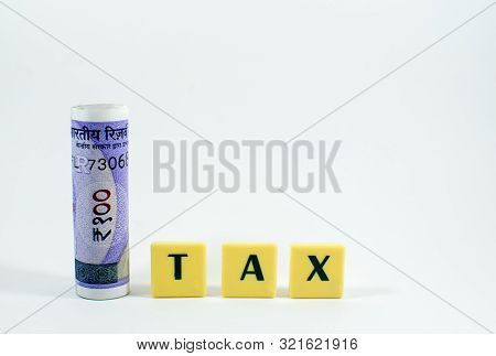 Tax Word Concept Light Background Image Using By Block Letter For Various Purposes Of Tax Related Wo