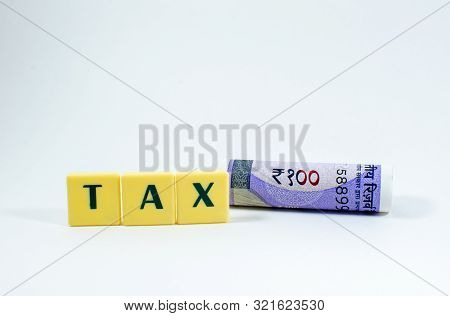 Tax Word Concept Light Background Image Using By Block Letter For Various Purposes Of Tax Related Wo