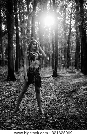 Sexy Legs. Amazon Woman. Sexy Witch. Cougar Female. Wild Woman In Forest. Sexy Girl In Leather Suede