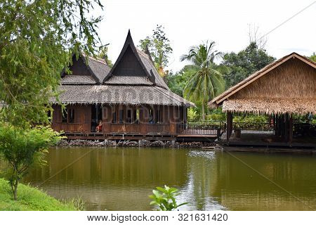 Kanchanaburi, Thailand, 09.09.2019: Beautiful Garden, Lake, Traditional Thai, Siamese Clothes, Build