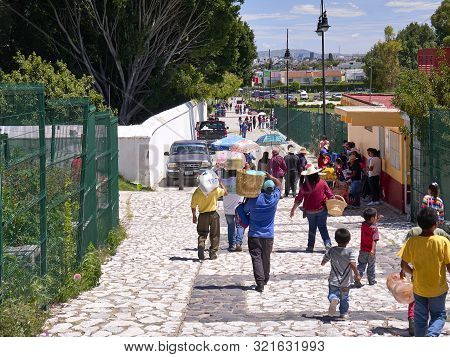 San Andres Cholula, Mexico, September 30, 2018 - People Who Work And Tourists Walk Along The Calle 8