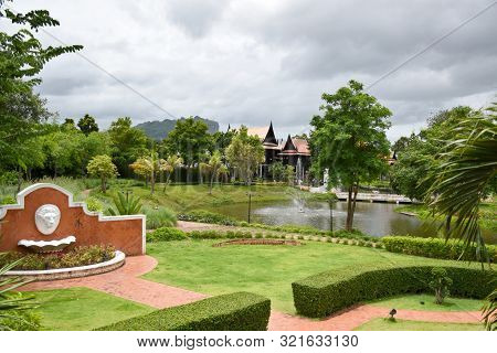 Kanchanaburi, Thailand, 09.09.2019: Beautiful Garden, Lake, Traditional Thai, Siamese Clothes, Build