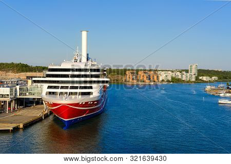 Sea Port On The Aurajoki River, With A Passenger Ferry Standing At The Pier. Turku, Finland.