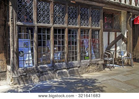 Canterbury, Great Britain - May 15, 2014: This Is A Fragment Of A Wooden Display Case On The Facade 
