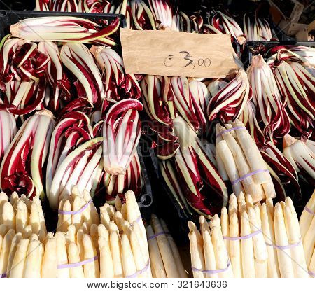Boxes Of Red Radicchio Typical Of Northern Italy Called Radicchio Tardivo And White Asparagus For Sa