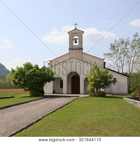 Small White Church In The Cimano Town In Northern Italy Near Udine City