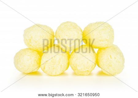 Group Of Seven Whole Salted Yellow Corn Puff Isolated On White Background