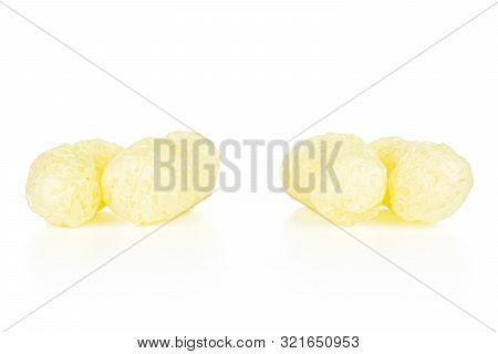 Group Of Four Whole Salted Yellow Corn Puff Isolated On White Background