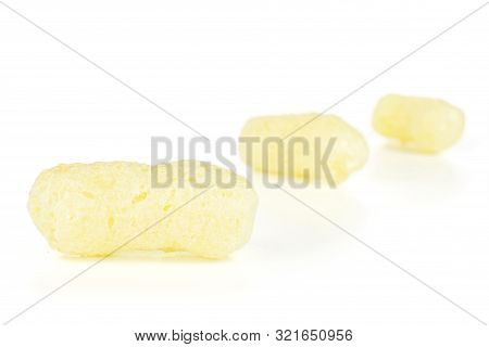 Group Of Three Whole Salted Yellow Corn Puff Placed Diagonally Isolated On White Background