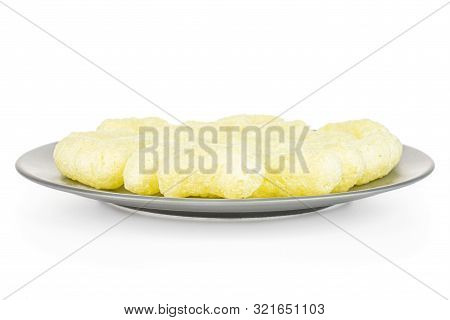 Lot Of Whole Salted Yellow Corn Puff On Gray Ceramic Plate Isolated On White Background