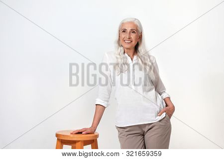 Portrait Of Beautiful Mature Woman On Light Background