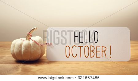 Hello October Message With A White Small Pumpkin