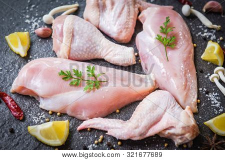 Fresh Raw Chicken With Mushroom Lemon Chilli Herbs And Spices On Plack Plate / Breast Wings And Legs