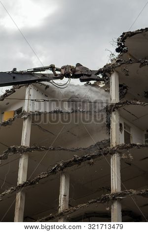 Demolition Pulveriser Demoliting Building In The City