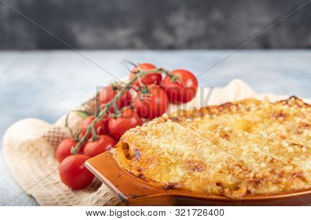 Traditional Italian Cannelloni Vegetables, Minced Meat And Cheese. On A Wooden Background. Top View,