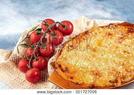 Traditional Italian Cannelloni With Vegetables, Minced Meat And Cheese. On A Wooden Background. Top 