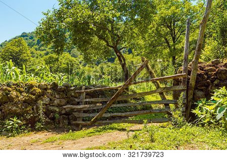 Old Rickety Wood Fence In The Countryside