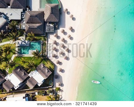 Aerial View Of Amazing Tropical White Sandy Beach With Palm Leaves Umbrellas And Turquoise Sea, Maur