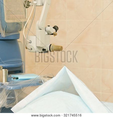 Ophthalmology Laser Microscope Operation. Clinic Room With Doctor And Parient. Gloves And Medicine T