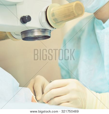 Ophthalmology Laser Microscope Operation. Doctor In Clinic. Patient Eye Treatment. Myopia And Catara