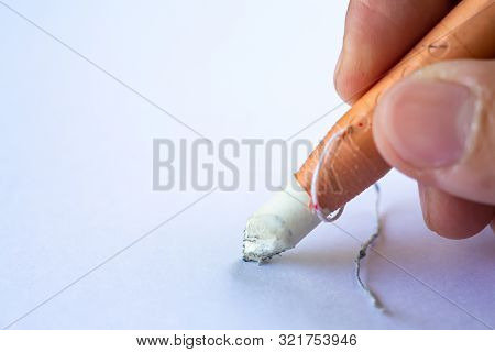 Woman's Right Hand Holding Dermatograph Pencil Writing Letter On White Paper Texture Background, Not
