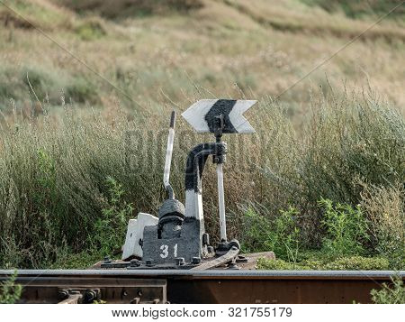 Old Railroad Arrow Switcher. Manual Rail Switch Mechanism. Rudiment And Symbol