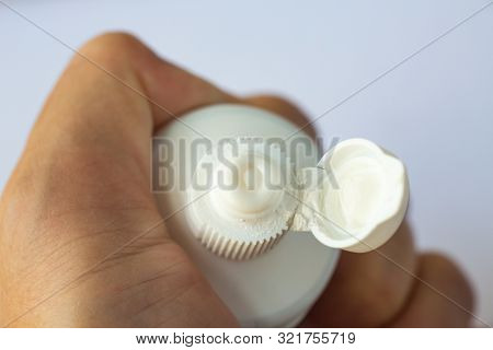 Woman's Hands Squeezing Toothpaste On White Background, Close Up & Macro Shot, Selective Focus, Heal