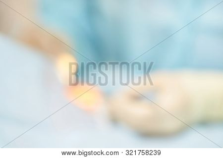 Ophthalmology Laser Microscope Operation. Clinic Room With Doctor And Parient. Blur Background. Unfo