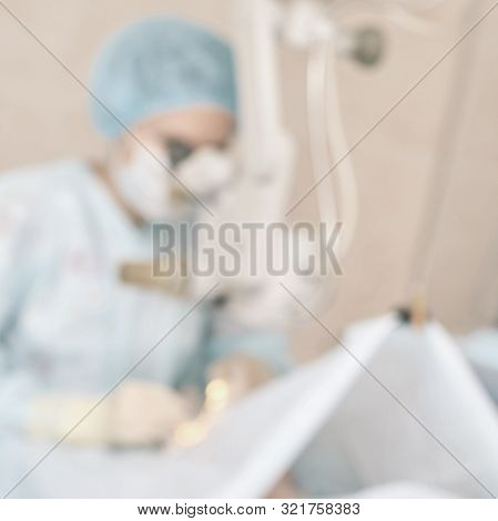 Ophthalmology Laser Microscope Operation. Clinic Room With Doctor And Parient. Blur Background. Unfo