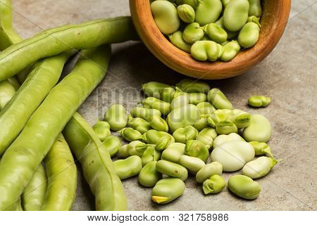 Raw Broad Beans On A Marble Table