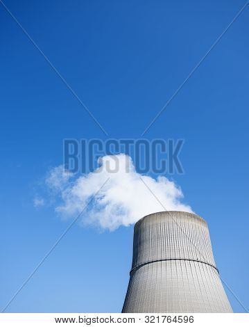 Steam And Blue Sky Above Large Chimney Of Nuclear Power Plant Near German Town Lingen In Lower Saxon