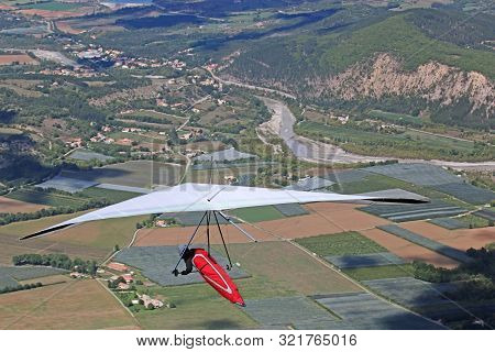 Hang Glider Flying From The Chabre Mountain, France