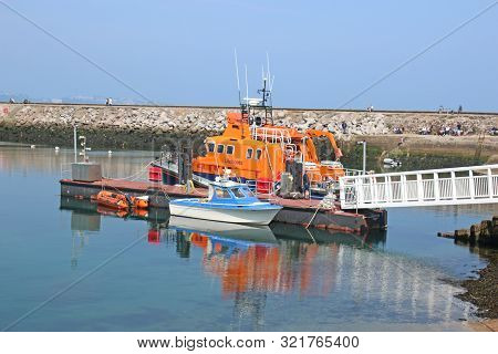 Lifeboat Moored In Brixham Harbour, Devon, England