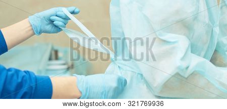 Ophthalmology Laser Microscope Operation. Clinic Room With Doctor And Parient. Gloves And Medicine T
