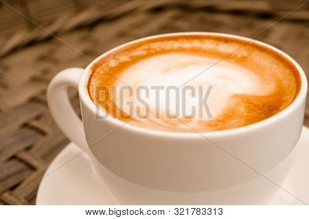 Close Up Cappuccino In White Cup On Wood Table Background At Cafe. Bewerages, Coffee Lovers And Morn